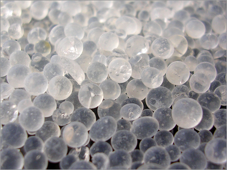 Small white porous solid beads, packed together